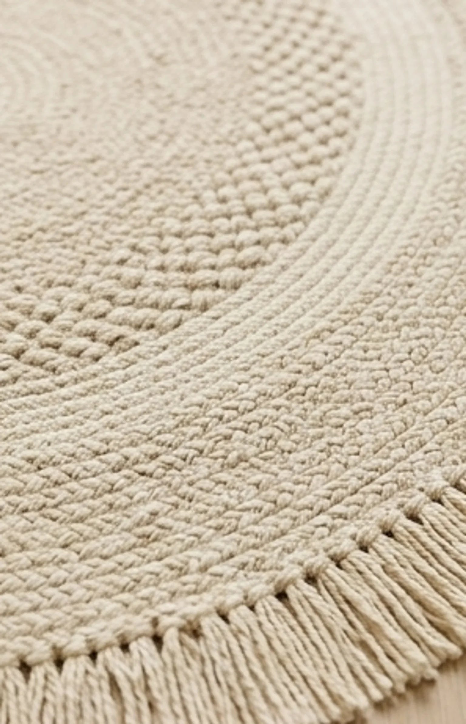 Round Wool Braided Rug — macro close-up showing material texture and finish