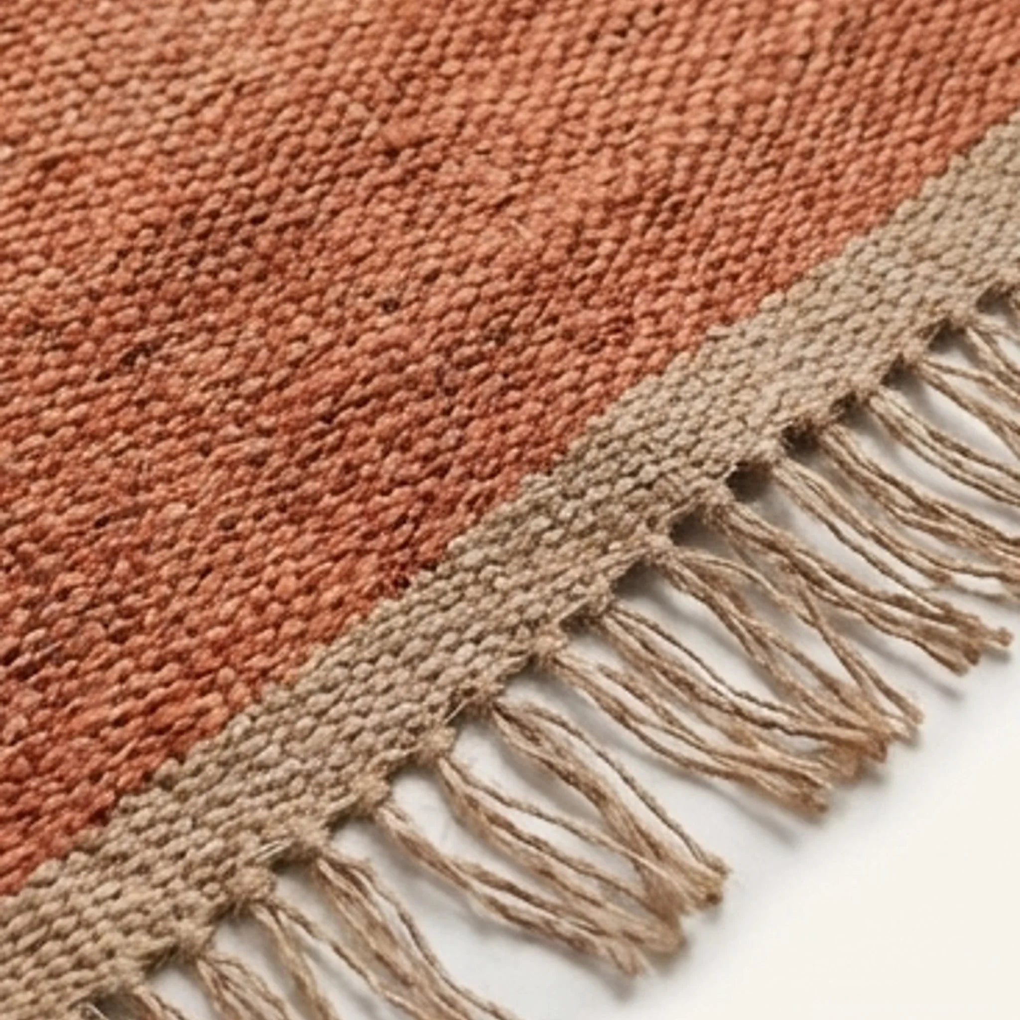 Handwoven Jute Rug - Natural & Rustic — macro close-up showing material texture and finish