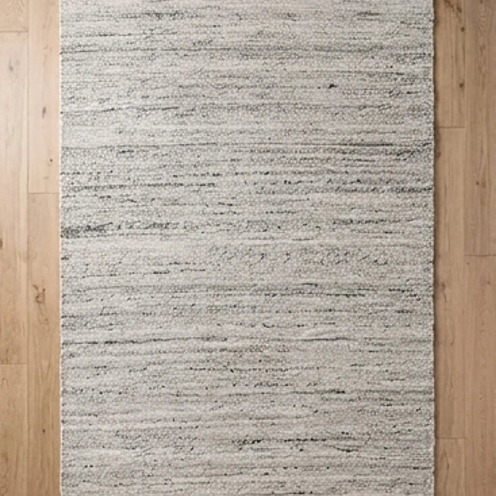 Natural Wool Carpet — overhead flat-lay on a natural surface