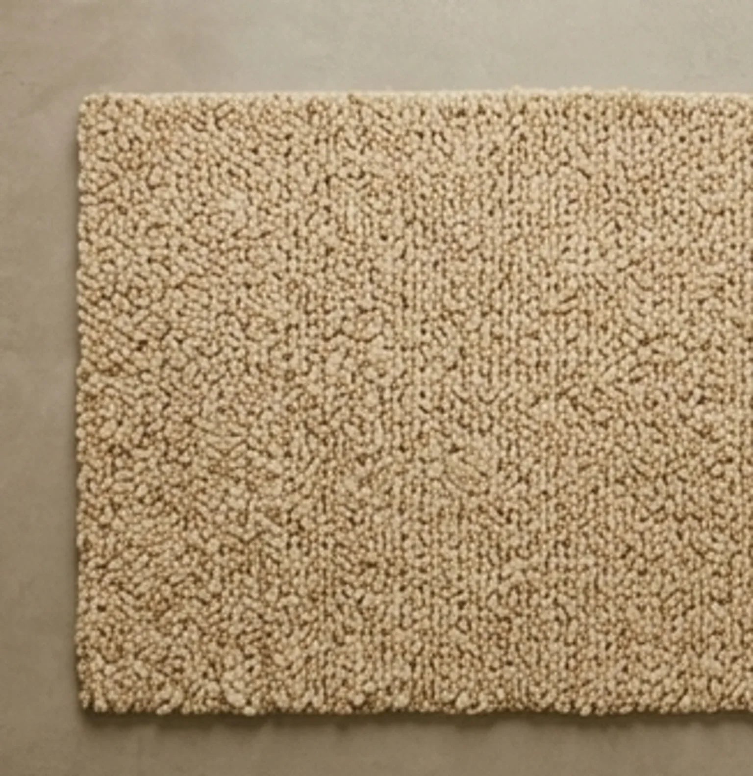 Hand-Woven Wool Shaggy Rug — overhead flat-lay on a natural surface