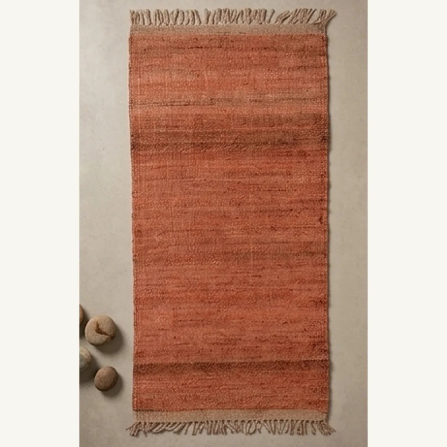 Handwoven Jute Rug - Natural & Rustic — overhead flat-lay on a natural surface