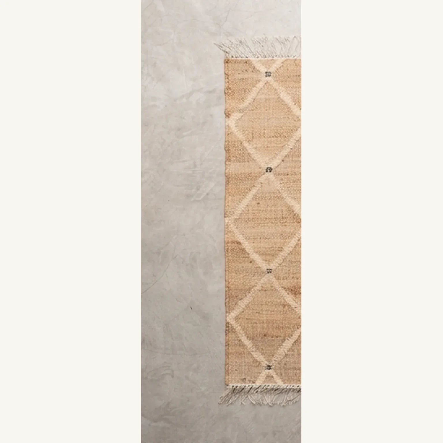 Indian Jute Rug - Beige Diamond Pattern — overhead flat-lay on a natural surface