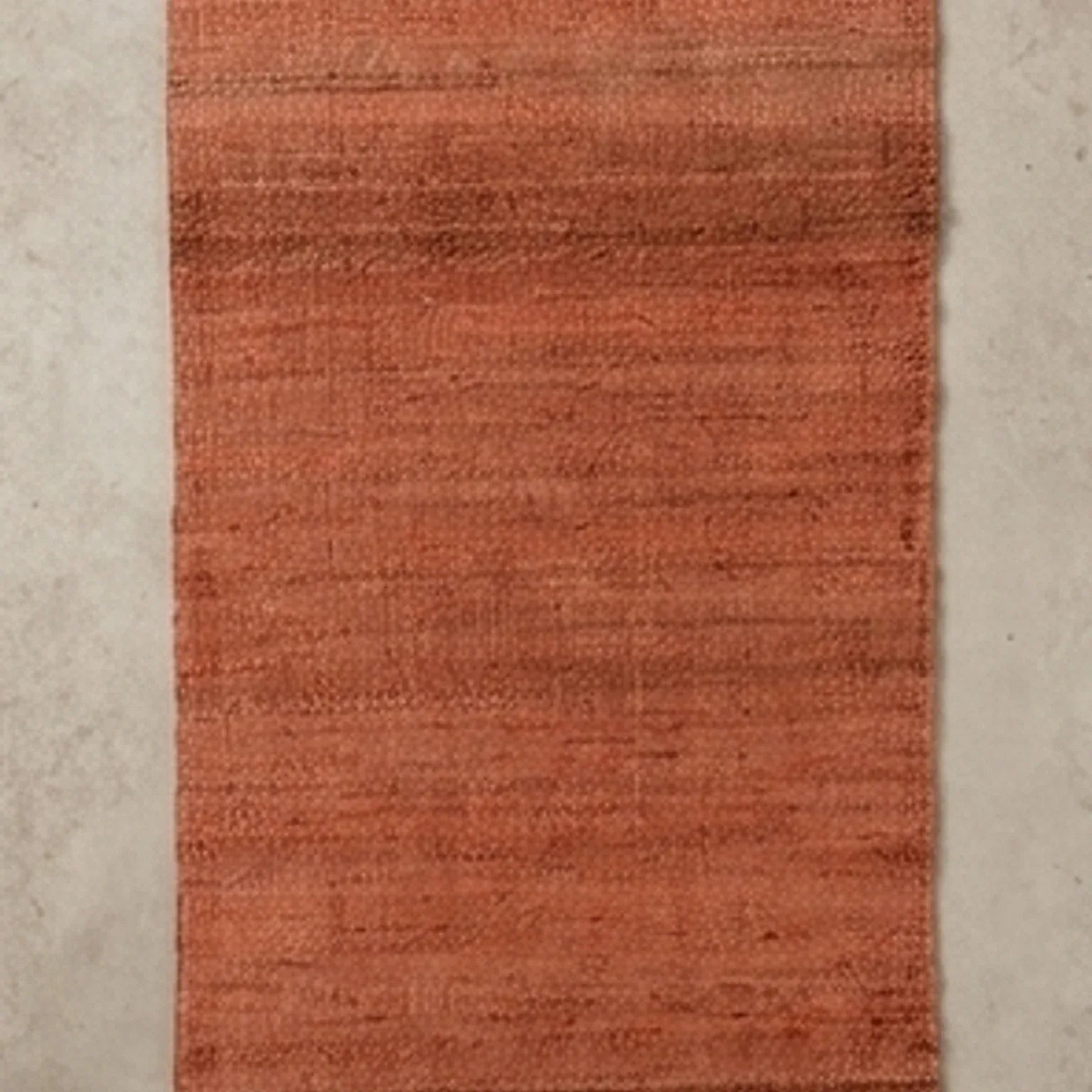 Handwoven Jute Rug - Natural & Rustic — overhead flat-lay on a natural surface