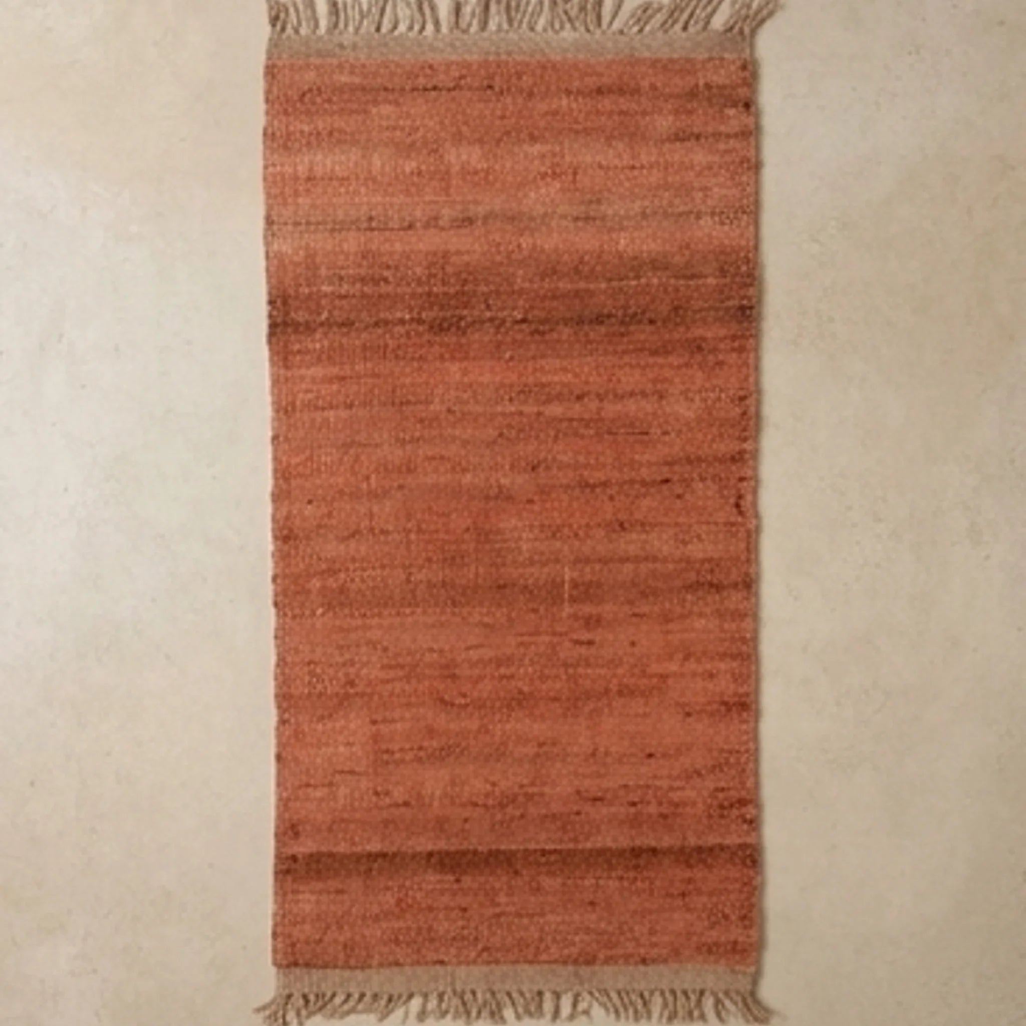Handwoven Jute Rug - Natural & Rustic — overhead flat-lay on a natural surface