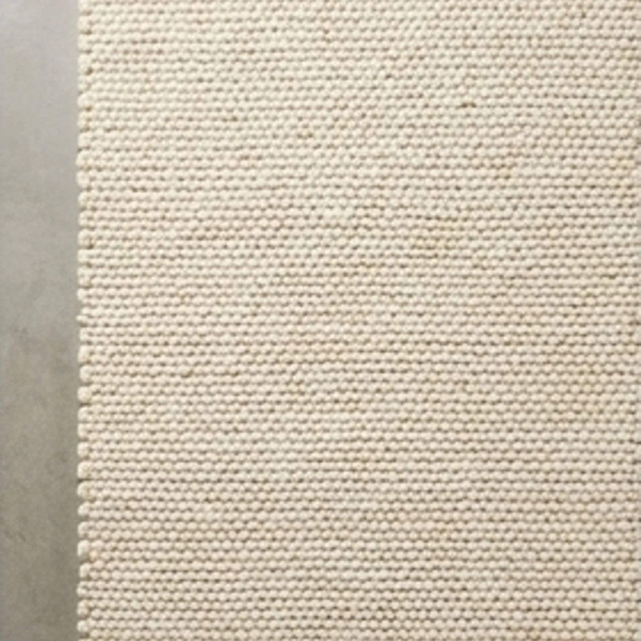 Wool Handwoven Cream Rug — overhead flat-lay on a natural surface