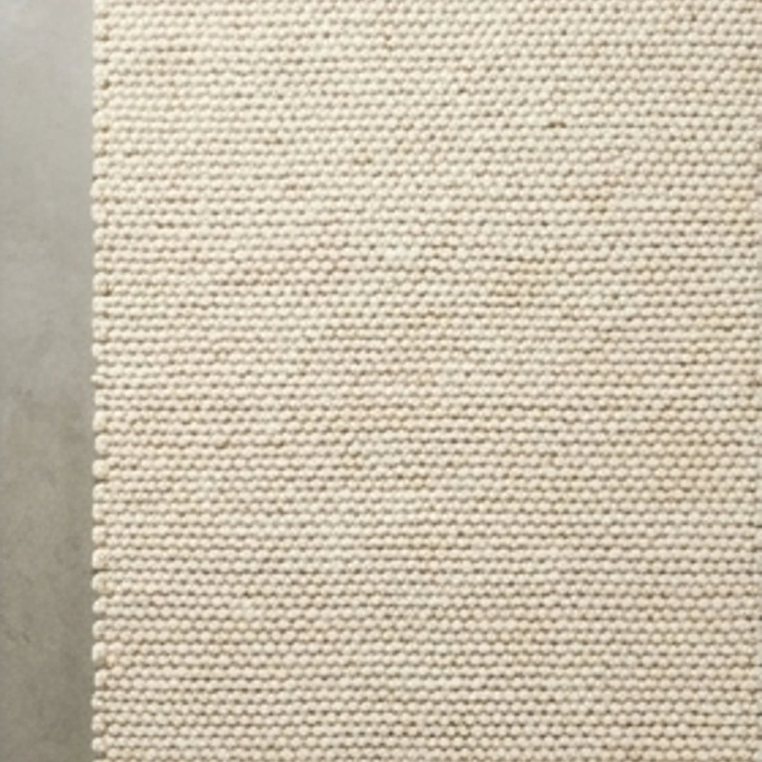 Wool Handwoven Cream Rug — overhead flat-lay on a natural surface