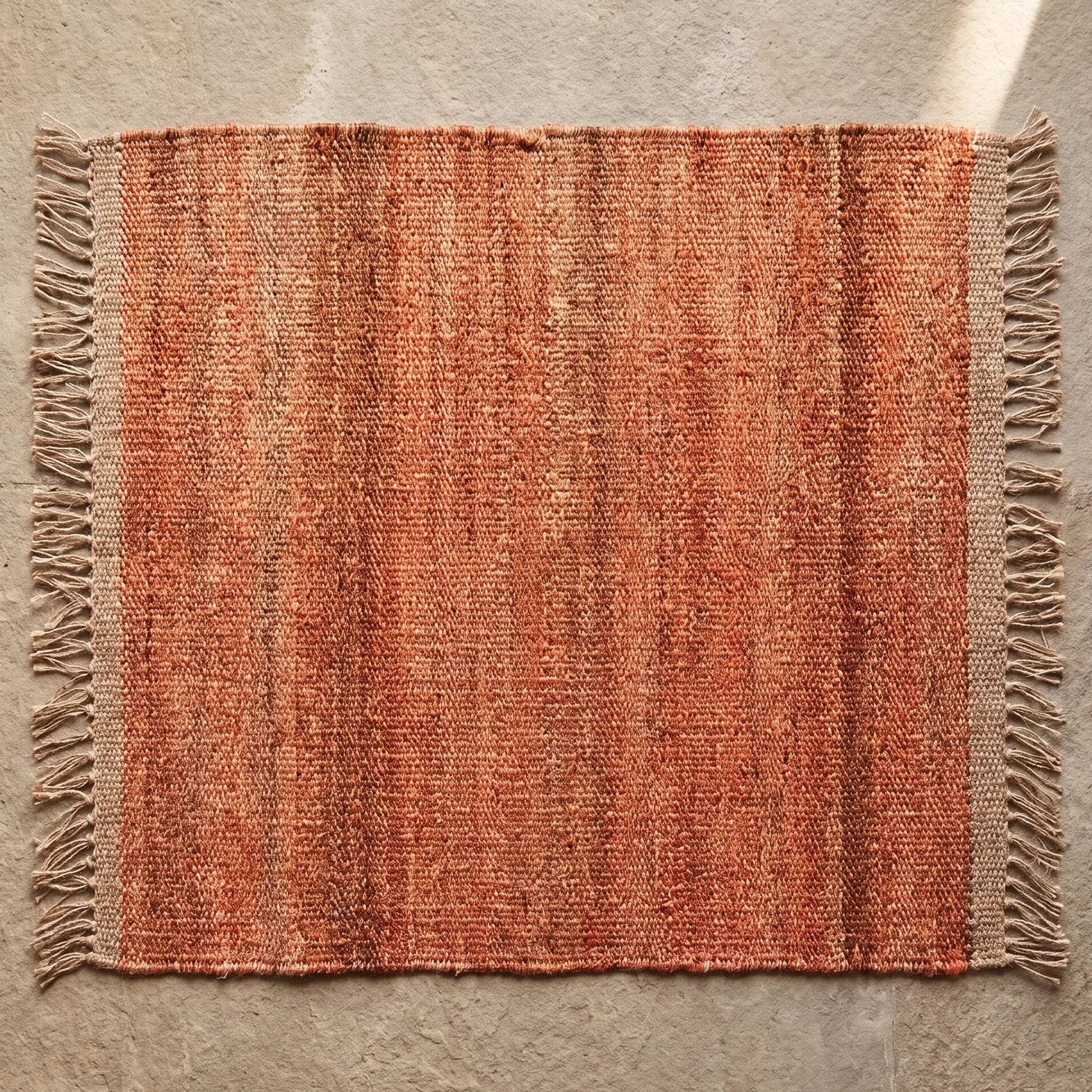 Handwoven Jute Rug - Natural & Rustic — overhead flat-lay on a natural surface