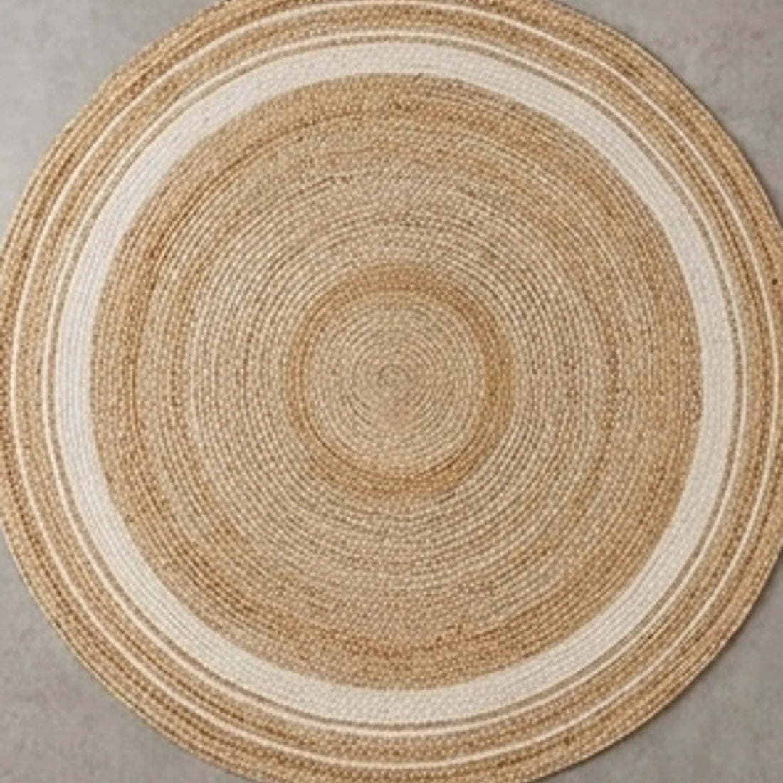 Round Jute Rug — overhead flat-lay on a natural surface