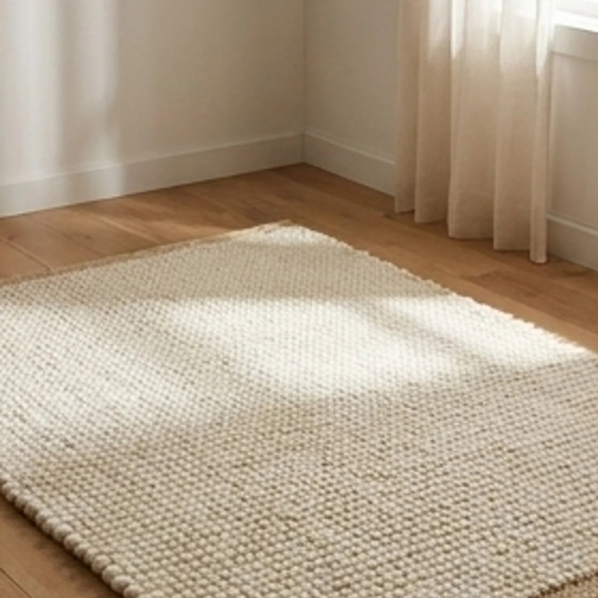 Wool Handwoven Cream Rug — ambient room context in soft natural light