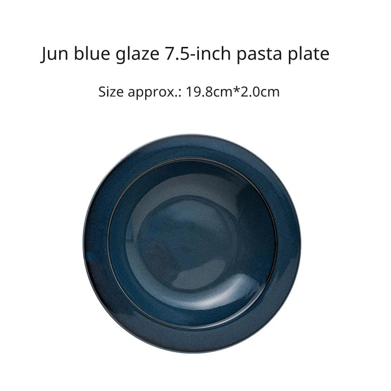 Overhead view of a 7.5 inch round dark blue ceramic pasta bowl with wide rim and glossy finish.