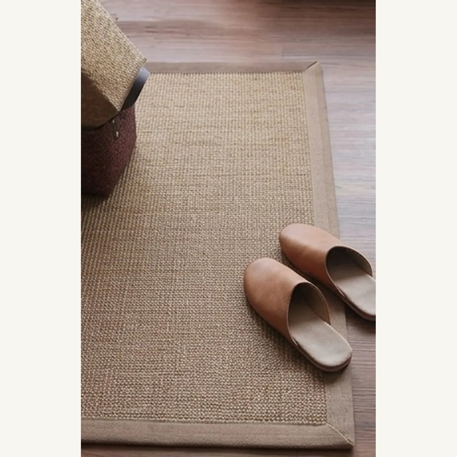 Natural Jute Rug – Handwoven | Tones, Rustic Home Decor — scale reference beside a complementary prop
