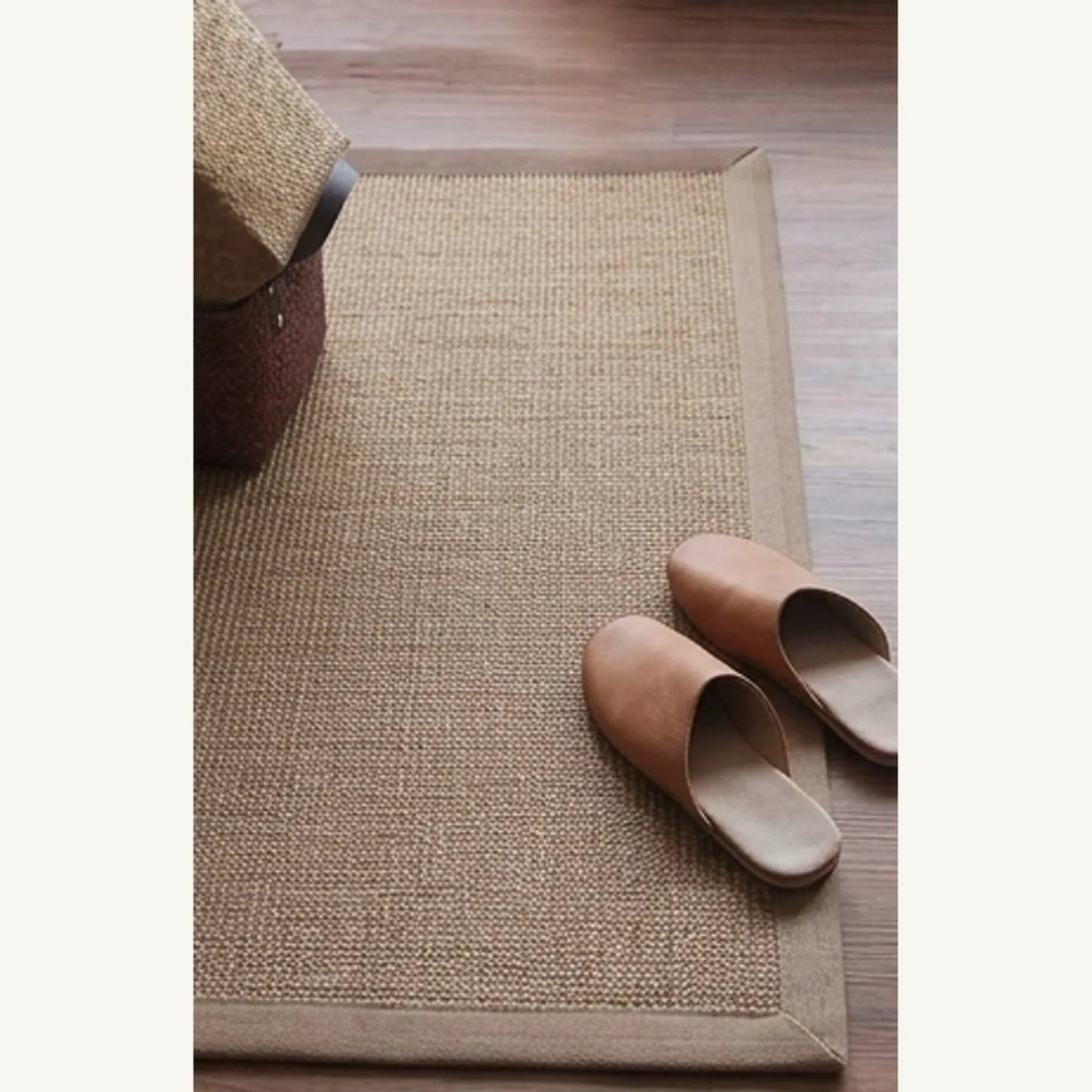 Natural Jute Rug – Handwoven | Tones, Rustic Home Decor — scale reference beside a complementary prop