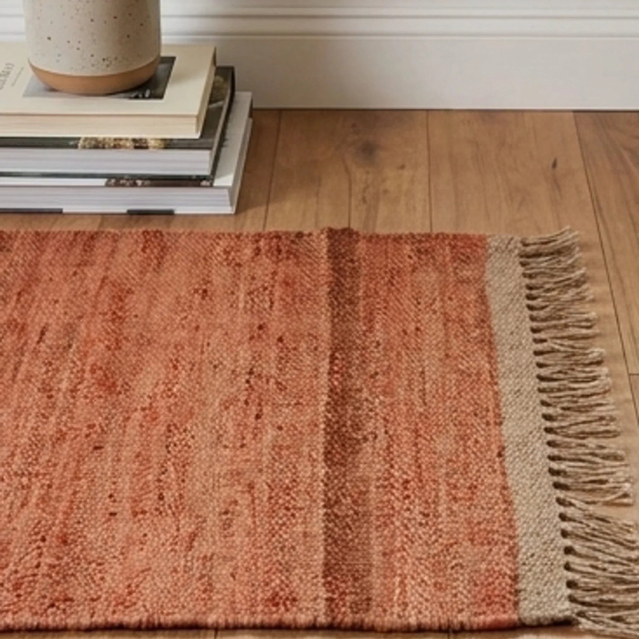 Handwoven Jute Rug - Natural & Rustic — scale reference beside a complementary prop