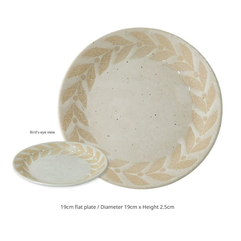 19cm flat plate and small matching bowl with beige speckled glaze and leaf pattern.