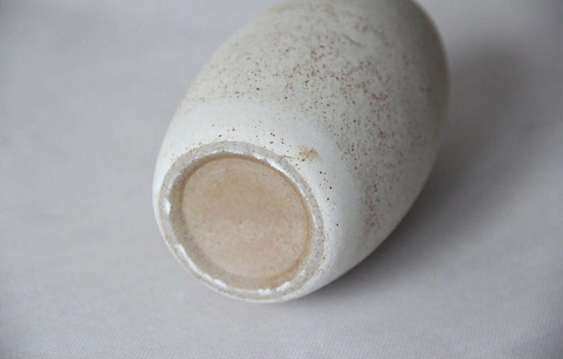 Cream ceramic vase, unglazed, small.