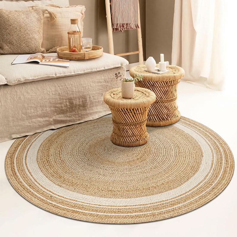 Round Jute Rug with natural fiber texture and white stripe detail in a bohemian living room setting.