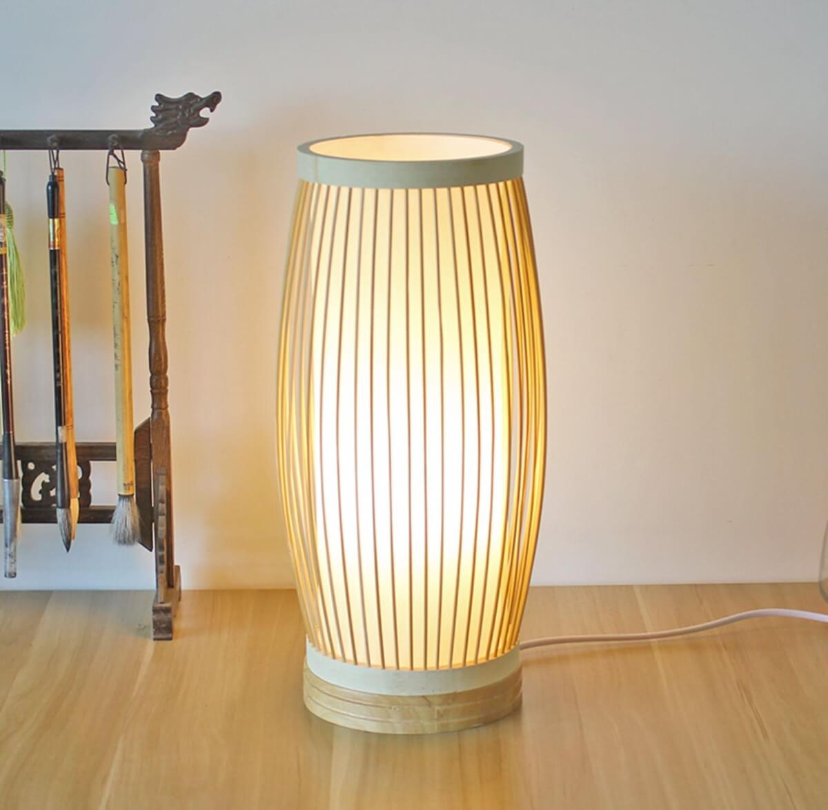 Bamboo Rattan Vertical Floor Lamp with wicker shade on wooden floor