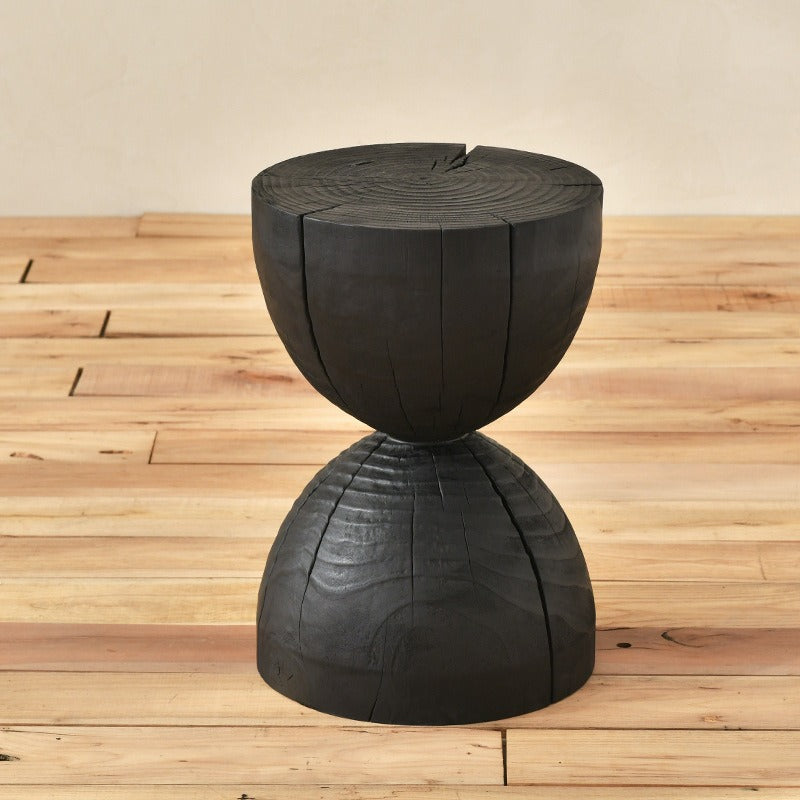 Black wooden stool, unique design.