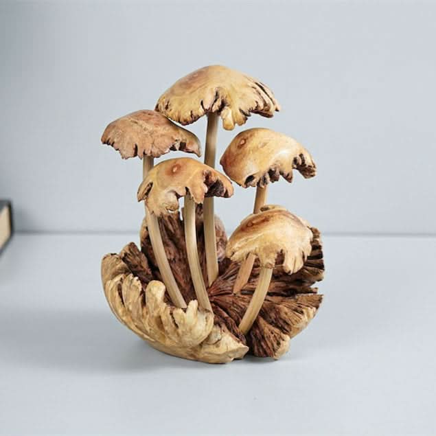 Hand-carved mushroom sculpture, natural wood tones, rustic home decor.