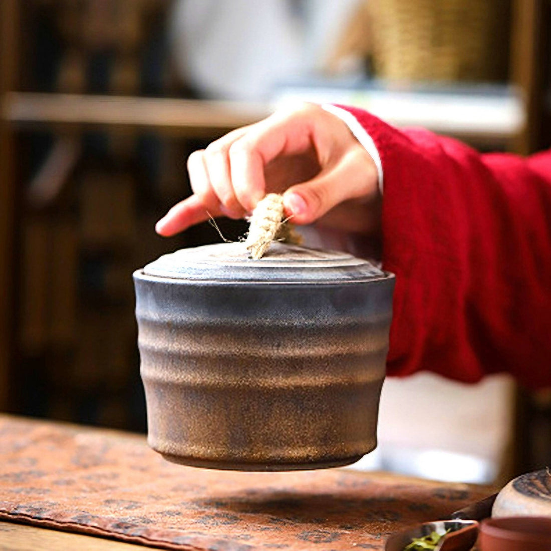 Individual holding the Wabi-Sabi Bucket Ceramic Jars