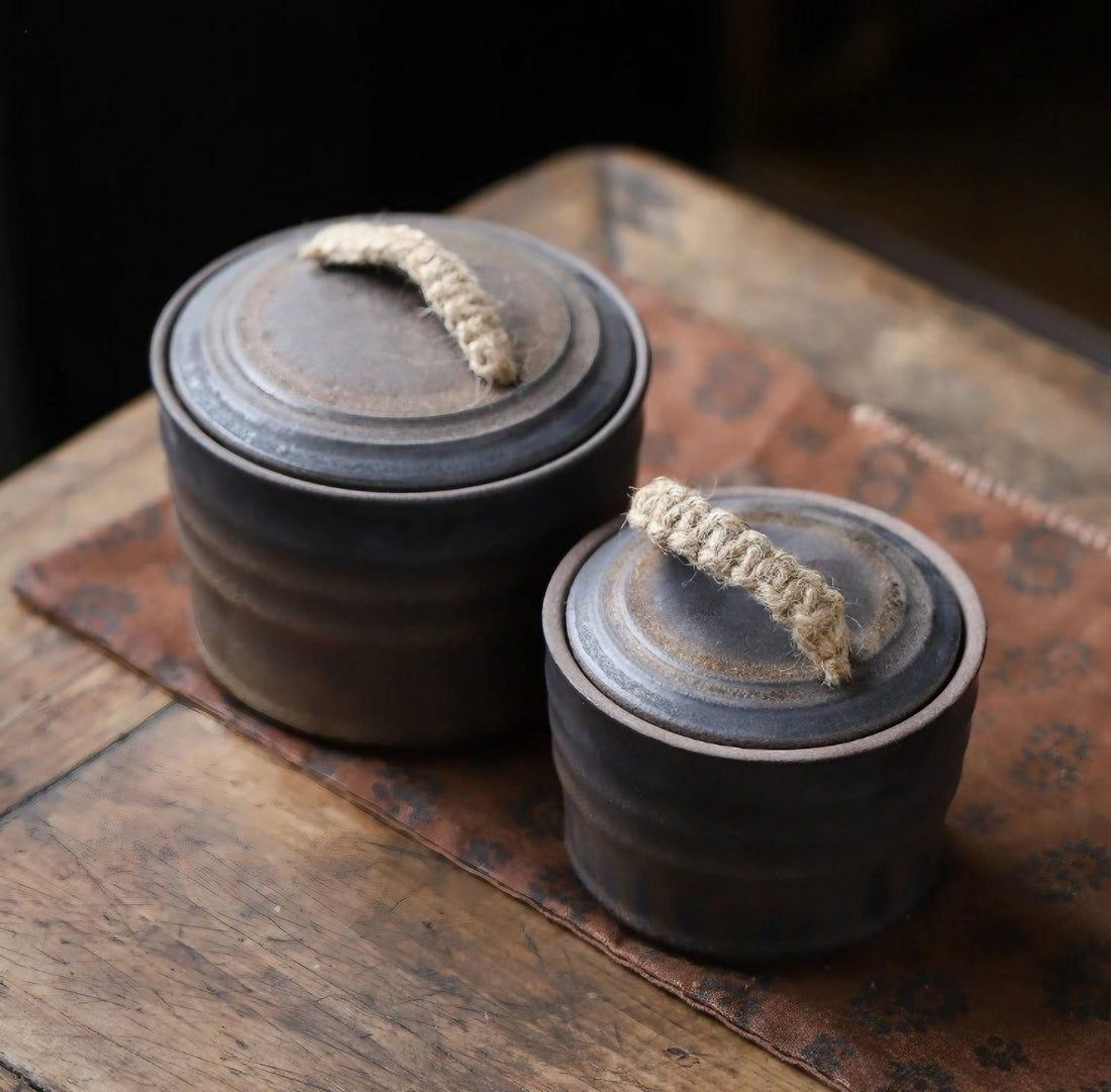 Two Wabi-Sabi Bucket Ceramic Jars with handles displayed on a wooden surface