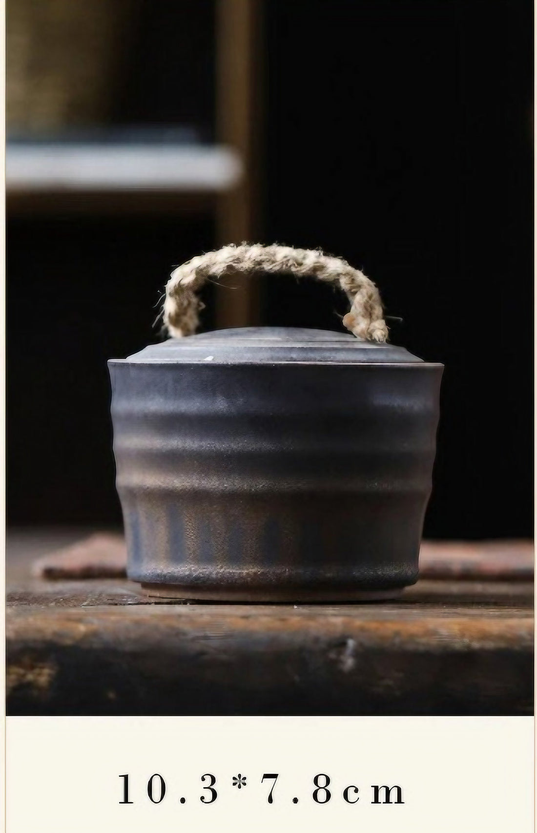 Wabi-Sabi Bucket Ceramic Jar with a rope handle, placed on a wooden table for display