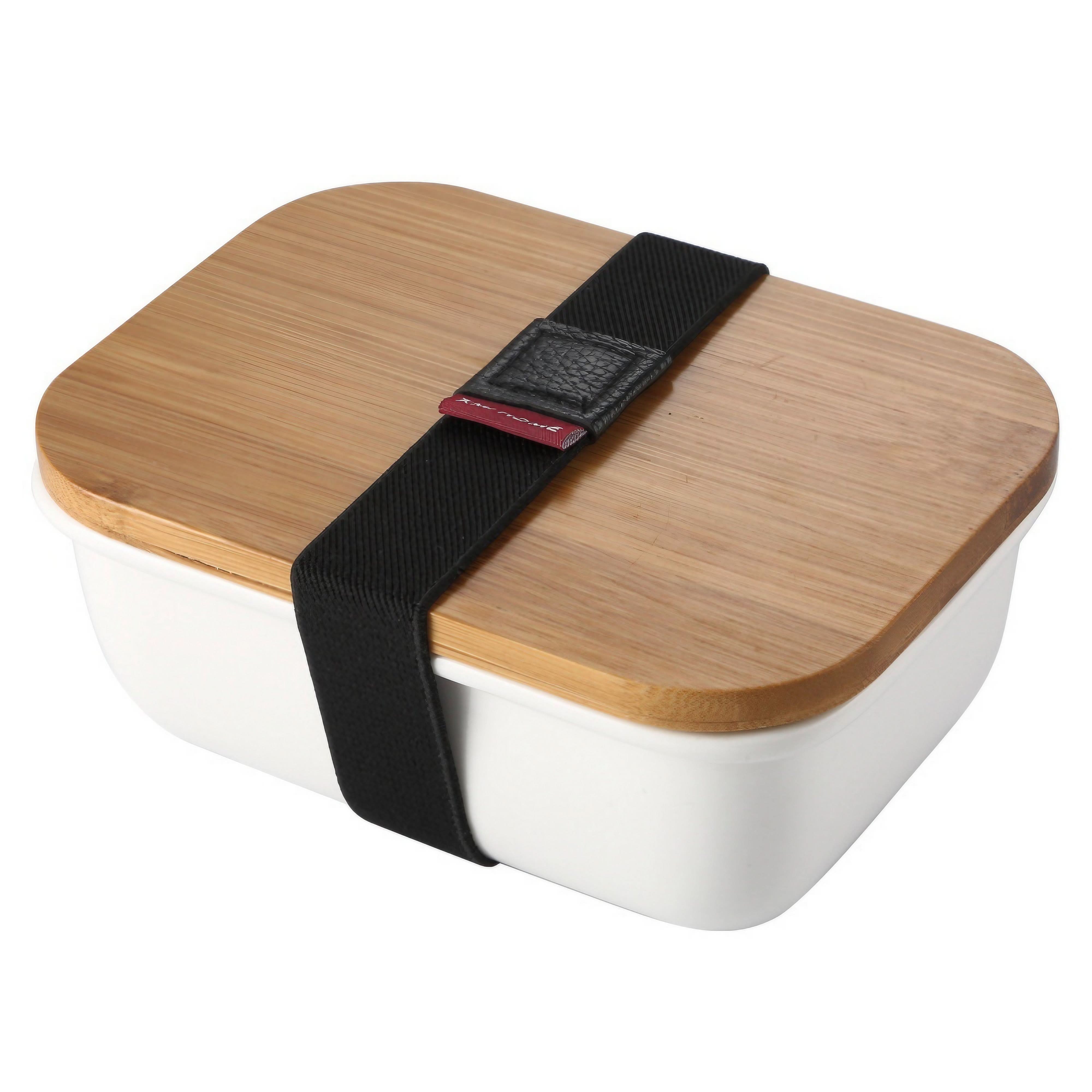 White ceramic bento box with bamboo lid and black strap, set on a white background.