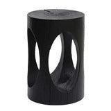 Black wooden stool with carved-out circles; rustic design.