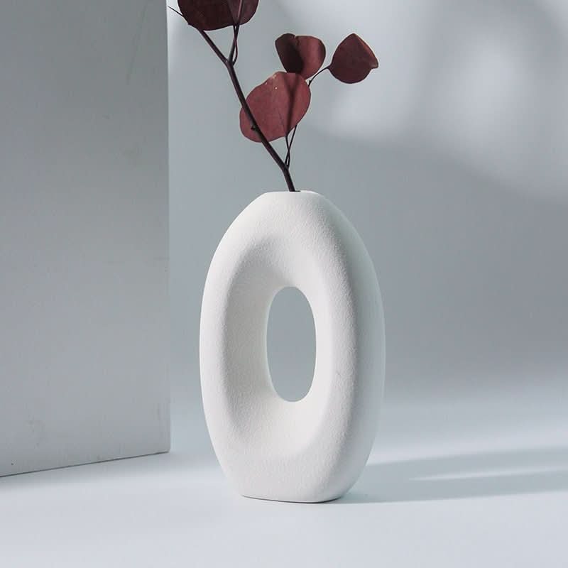 2x1 Nordic hollow matte white vase for dried flowers, minimalist home decor, natural lighting.