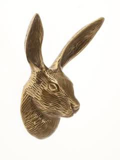 Antique brass hare wall hook for home decor, detailed rabbit head design.