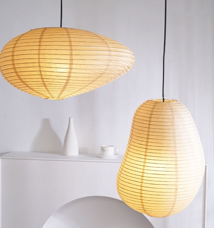 Paper lampshades irregular shape, warm ambient light, delicate linear texture. Home decor lighting.