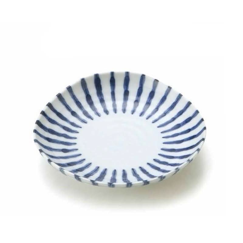 Blue and white ceramic plate with radial stripe pattern, made in Japan.