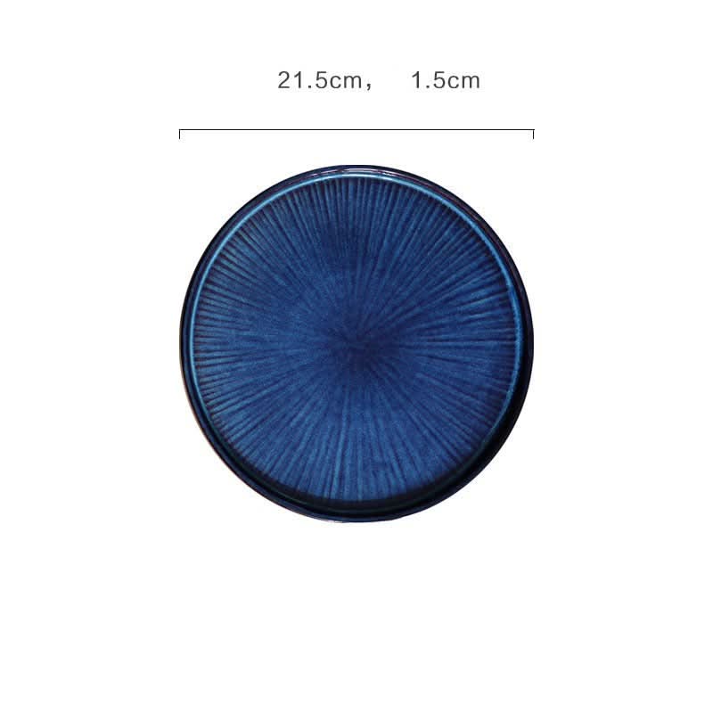 Deep blue flat ceramic glazed plate with kiln-fired texture.