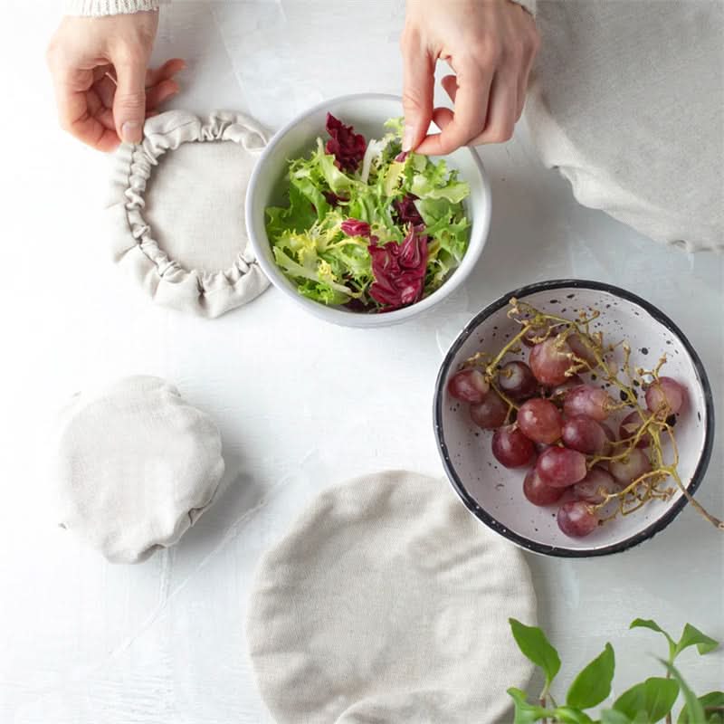 Natural linen bowl covers shown with salad and grapes, home decor accent.