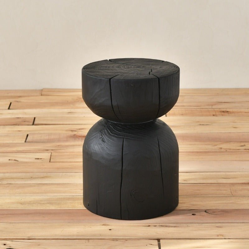 Black wooden stool, rustic design.