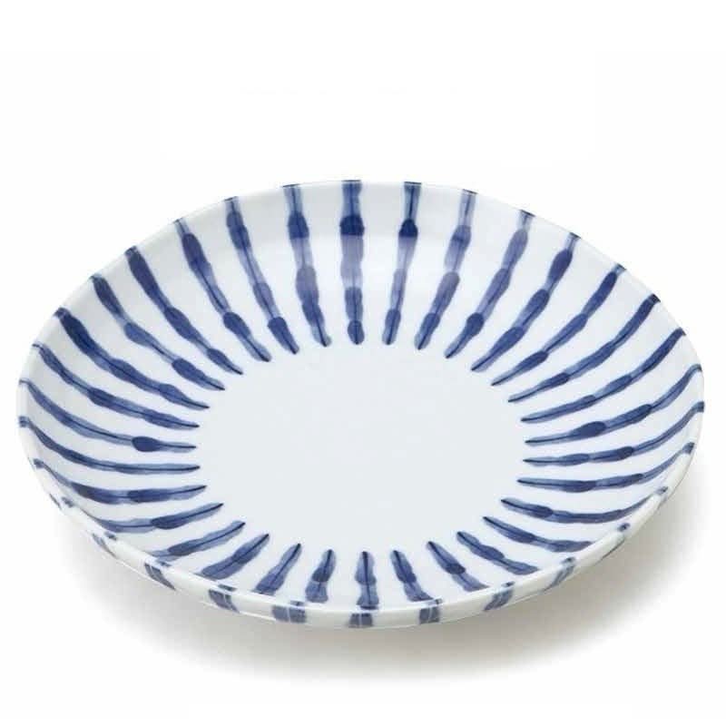 Blue and white ceramic plate with Japanese brushstroke pattern. Made in Japan.