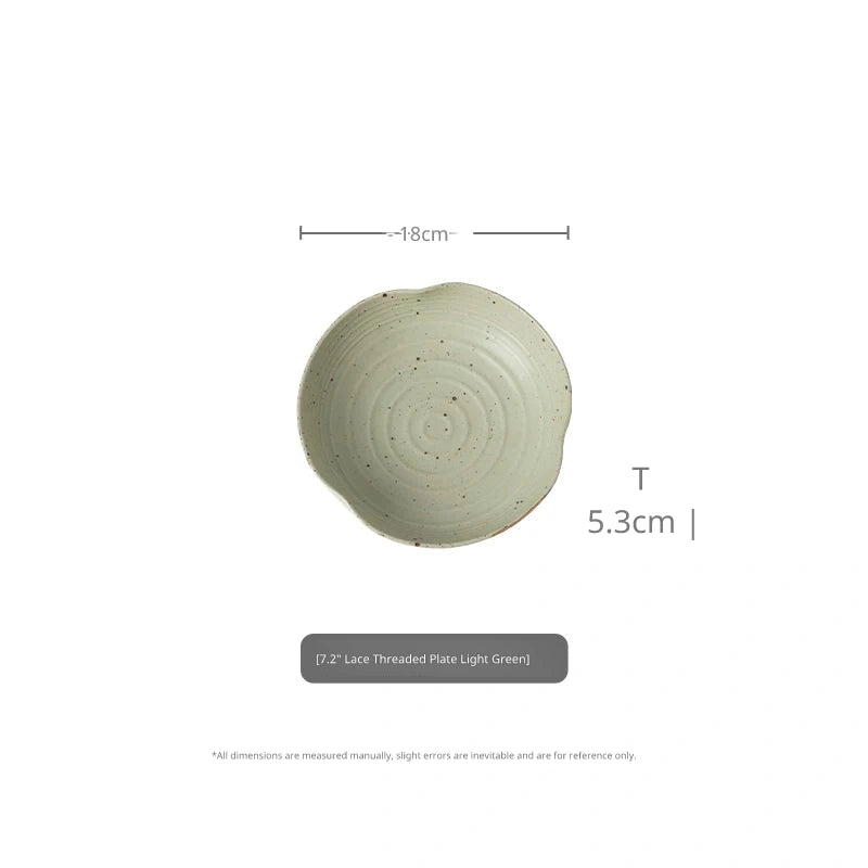 Top-down view of 7.2-inch light green speckled ceramic plate with 18cm diameter and 5.3cm height.