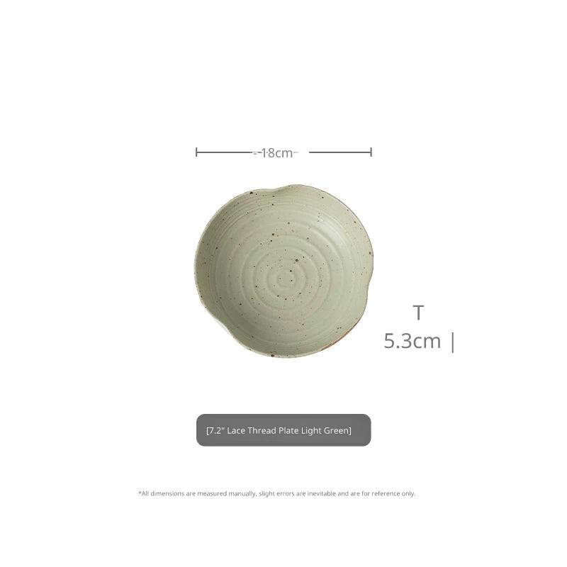 Top-down view of 7.2-inch light green speckled ceramic plate with 18cm diameter and 5.3cm height.