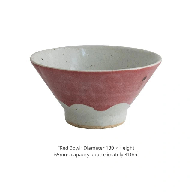 Product shot of a large dusty pink ceramic bowl with a wide opening.