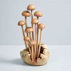 Hand-carved wooden mushroom sculpture in natural wood tones, home decor accent.