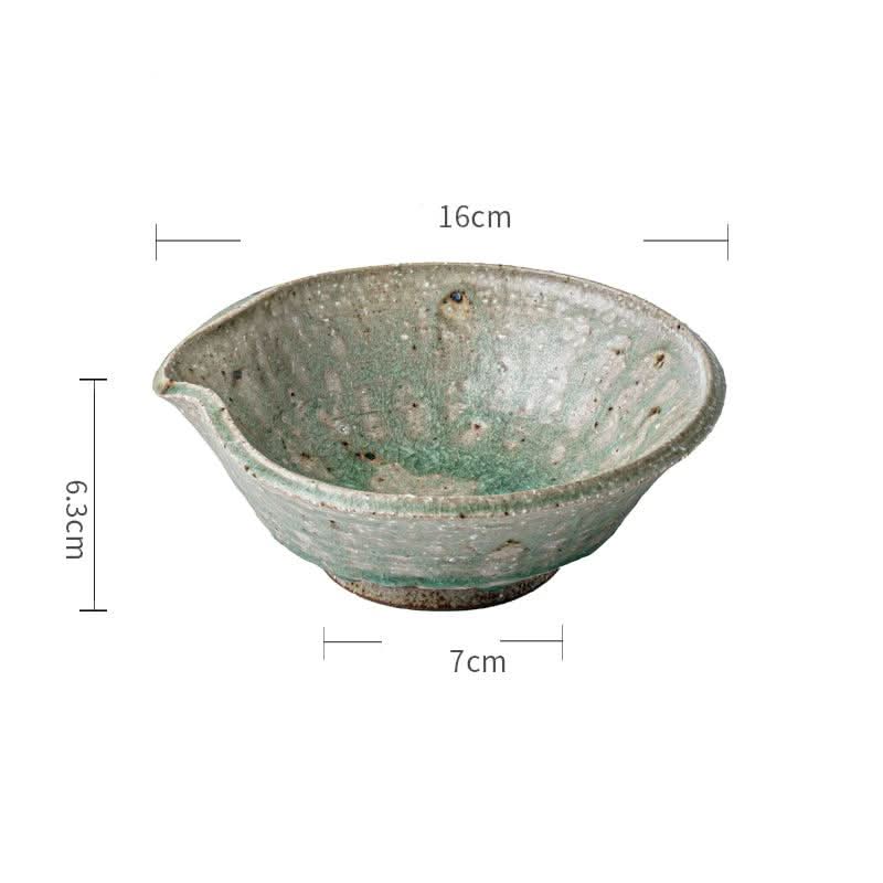 Artisan Green Dinnerware: rustic, speckled ceramic bowl with spout.