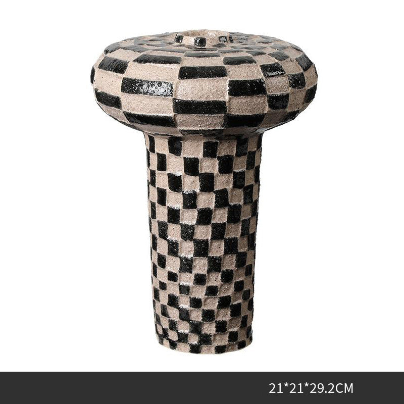 Striped ceramic decorative vase with black and beige pattern.