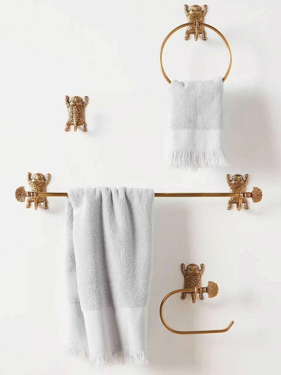 Gold Tiger-Inspired Bathroom Accessories Set: towel ring, bar, and toilet paper holder with tiger figures.