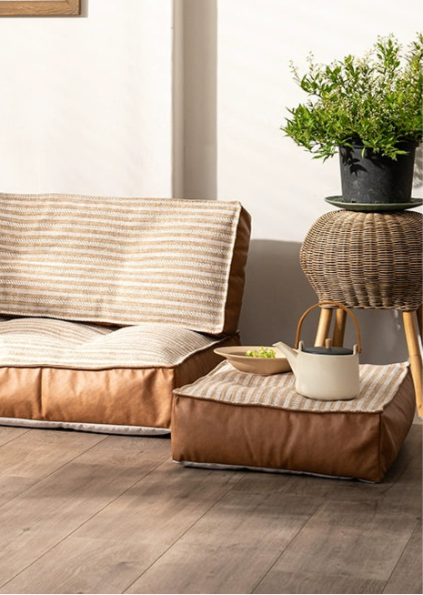 Modern Minimalist Floor Sofa with striped fabric and brown leather accents, perfect for comfortable seating.