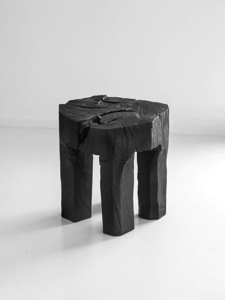 Black raw wood block side table, natural rustic home decor accent.