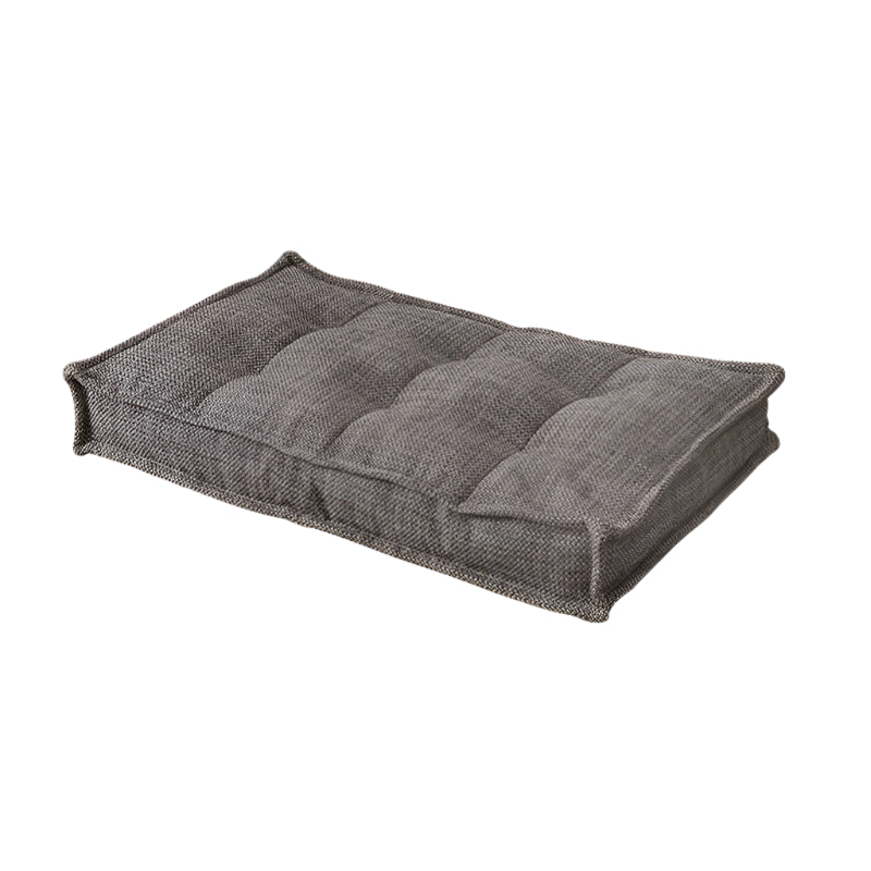 Gray fabric modular sofa section, tufted cushions,  modern design.