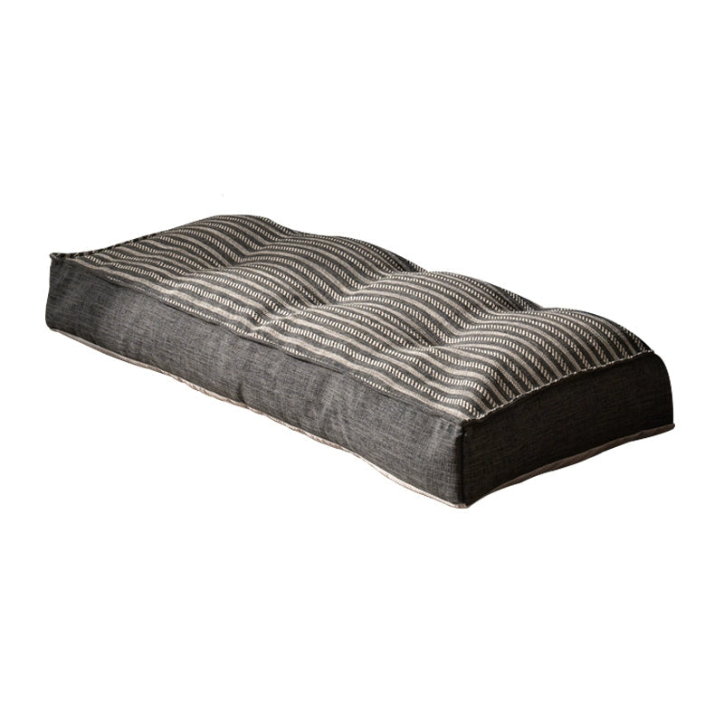 Modern minimalist floor sofa in striped fabric with comfortable seating.