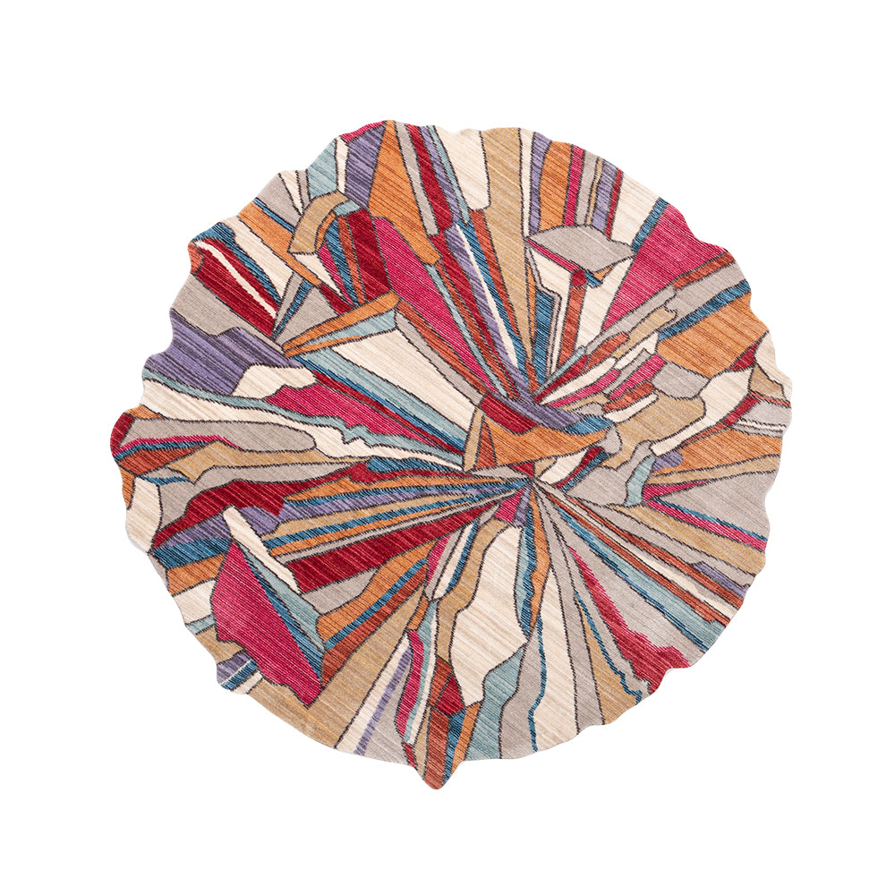 Unique abstract rug with colorful geometric patterns in red, orange, blue, and cream for fall/winter living rooms.
