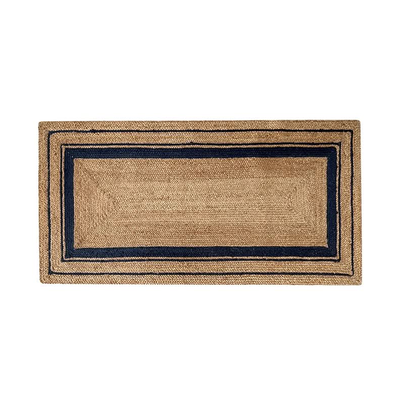 Natural jute rug with navy stripes, textured weave, rectangular home decor.