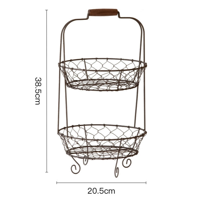 Two-tiered wire fruit basket stand, rustic brown, with wooden handle.  Oval wire baskets on each tier.